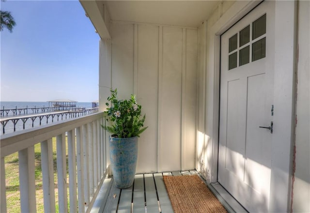 balcony featuring a water view