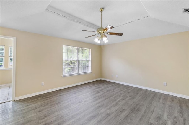 unfurnished room featuring hardwood / wood-style floors and ceiling fan