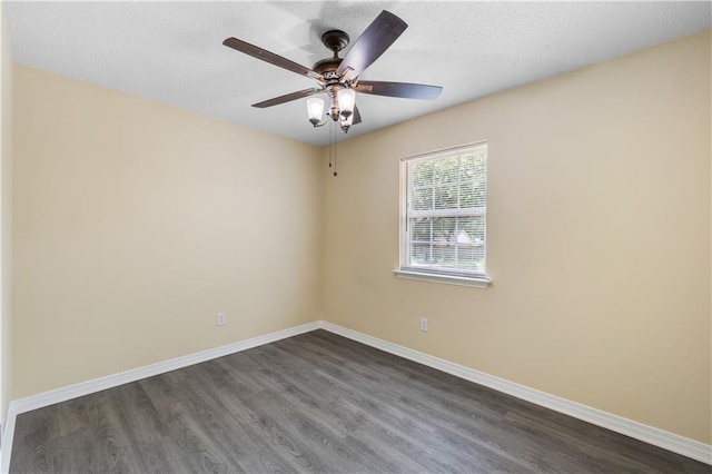 spare room featuring ceiling fan, a textured ceiling, and dark hardwood / wood-style floors