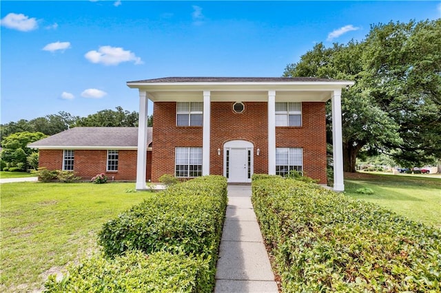 view of front of home with a front lawn