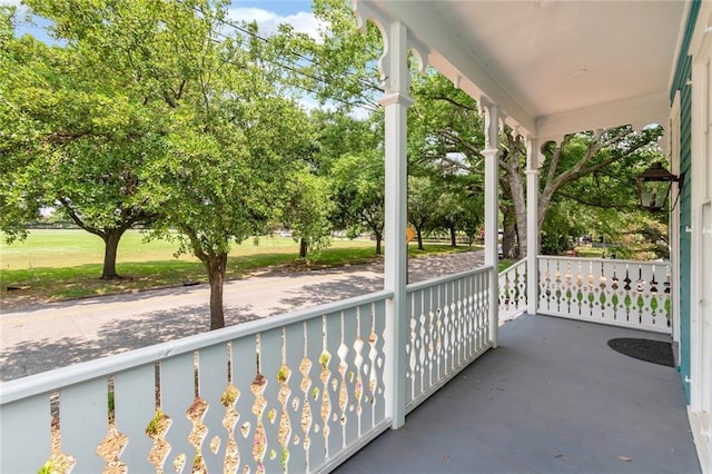 balcony featuring a porch