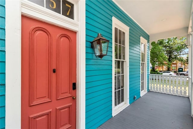 doorway to property featuring a porch