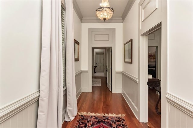 hallway featuring dark hardwood / wood-style flooring and ornamental molding