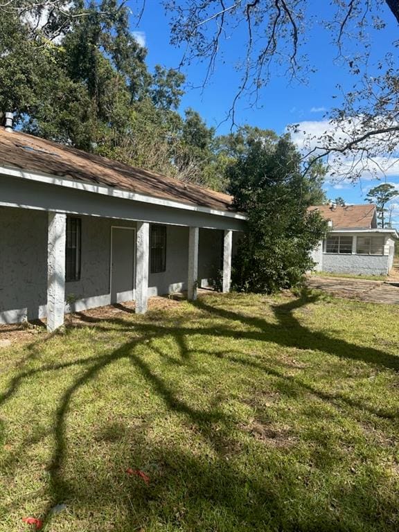 exterior space with a yard