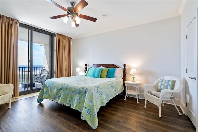 bedroom featuring ornamental molding, dark wood-type flooring, a wall of windows, and access to exterior