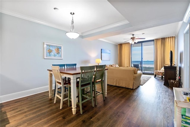 dining room featuring baseboards, expansive windows, ornamental molding, and dark wood-type flooring