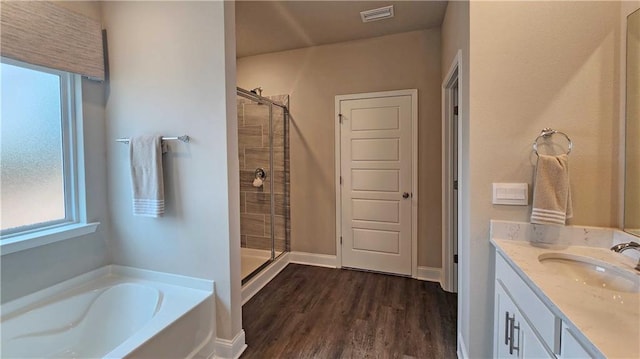 9851 Nadine Ln, Mobile, AL 36695 - full bathroom featuring plenty of natural light, a shower stall, and a garden tub