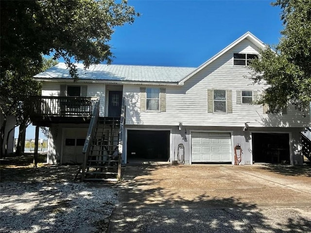 view of front of house featuring a wooden deck and a garage