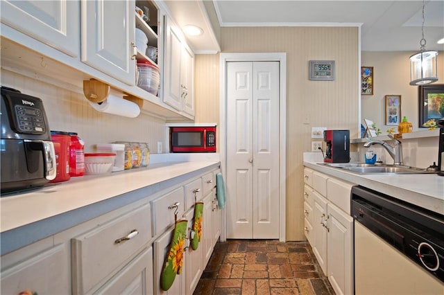 kitchen featuring white cabinetry, ornamental molding, dishwasher, and pendant lighting