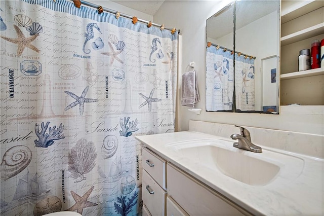 bathroom with vanity and curtained shower