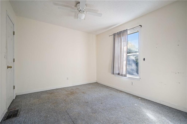 empty room with carpet, a textured ceiling, and ceiling fan