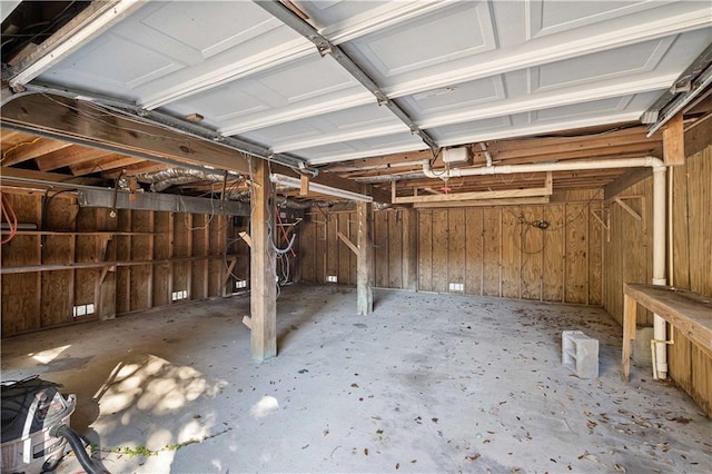 garage featuring wood walls