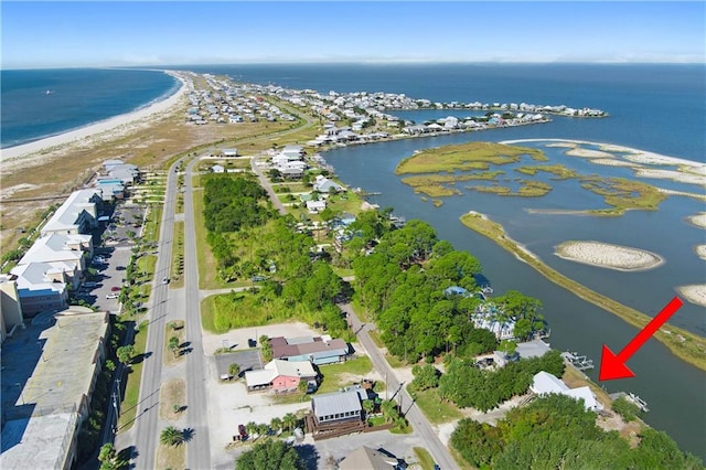 birds eye view of property featuring a view of the beach and a water view