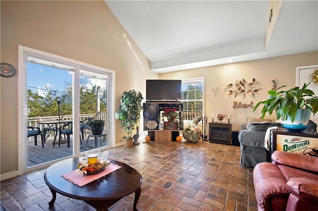 living room featuring a towering ceiling