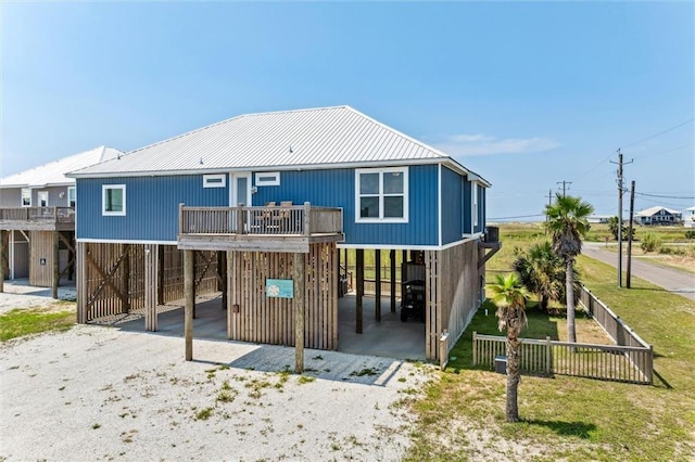 back of property featuring a carport