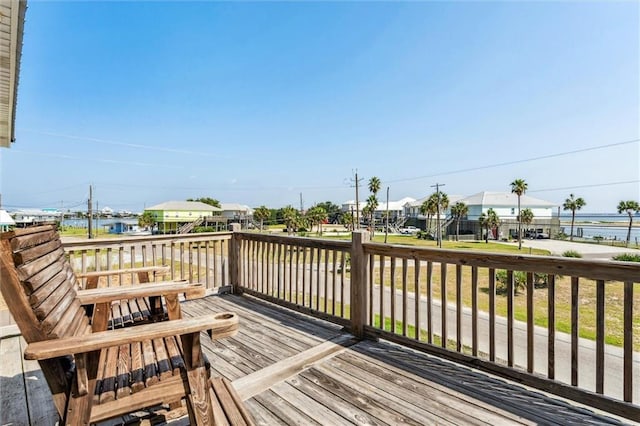 wooden deck with a water view