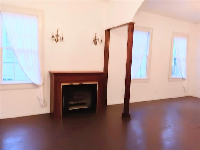 unfurnished living room with plenty of natural light