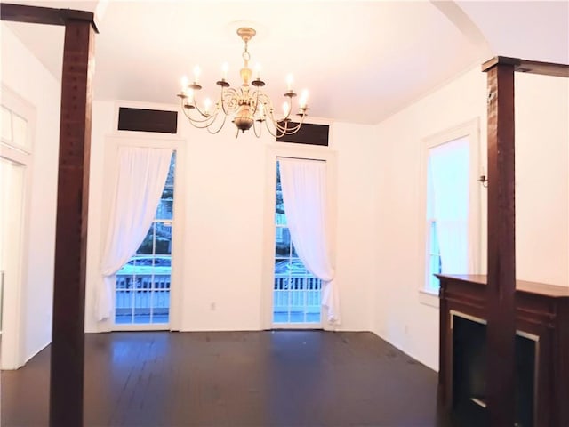 empty room featuring a chandelier