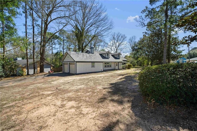 exterior space featuring a garage and driveway