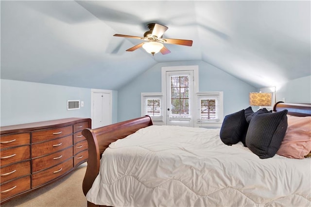 bedroom with carpet floors, ceiling fan, and vaulted ceiling