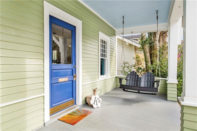 doorway to property with covered porch