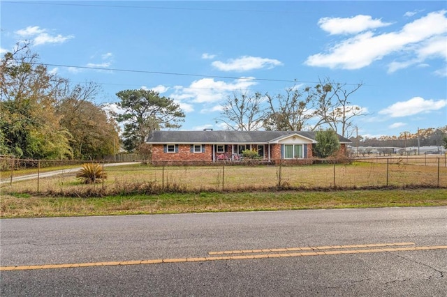 ranch-style home with a front lawn