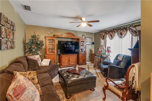 living room with ceiling fan and light carpet