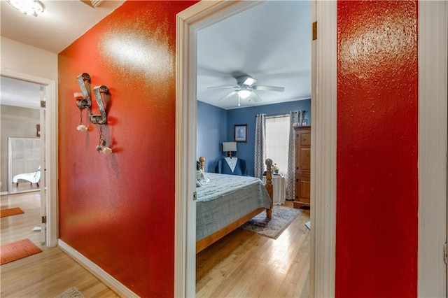 bedroom with hardwood / wood-style floors