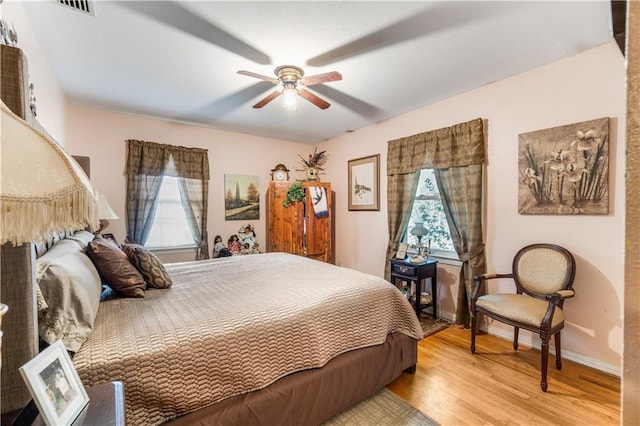 bedroom featuring ceiling fan and light hardwood / wood-style flooring