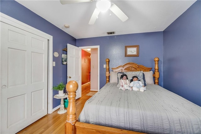 bedroom with hardwood / wood-style flooring and ceiling fan