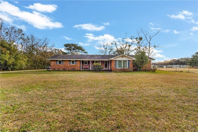 single story home with a front lawn