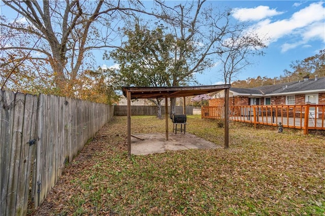 view of yard with a patio and a deck