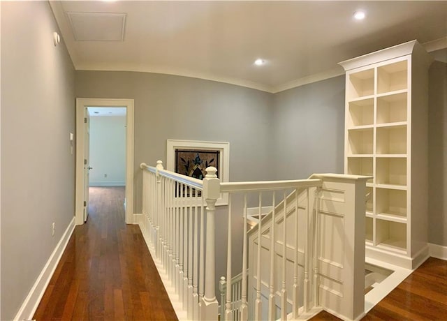 hall featuring dark hardwood / wood-style flooring and crown molding