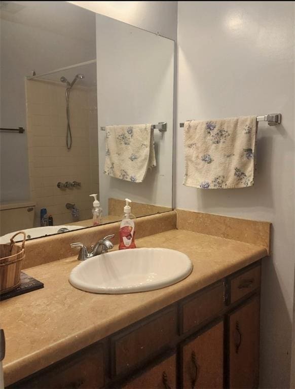 bathroom with bathtub / shower combination and vanity