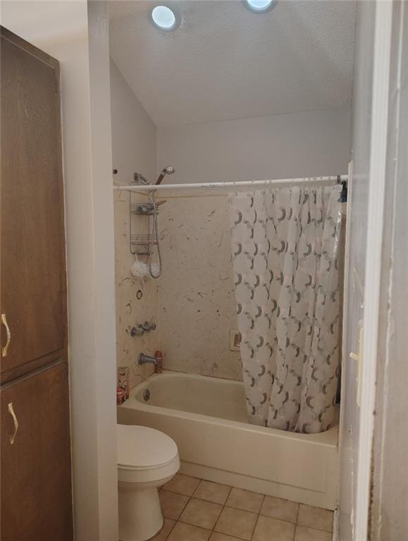 full bathroom featuring tile patterned flooring, toilet, and shower / bath combo with shower curtain