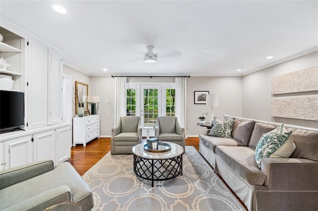 living room featuring crown molding, french doors, wood-type flooring, and ceiling fan