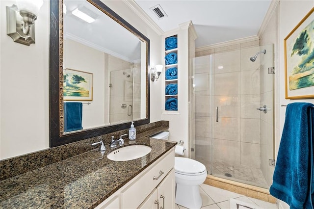 bathroom featuring tile floors, crown molding, vanity, and toilet