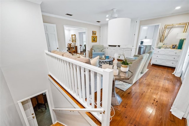 interior space featuring light hardwood / wood-style flooring and crown molding