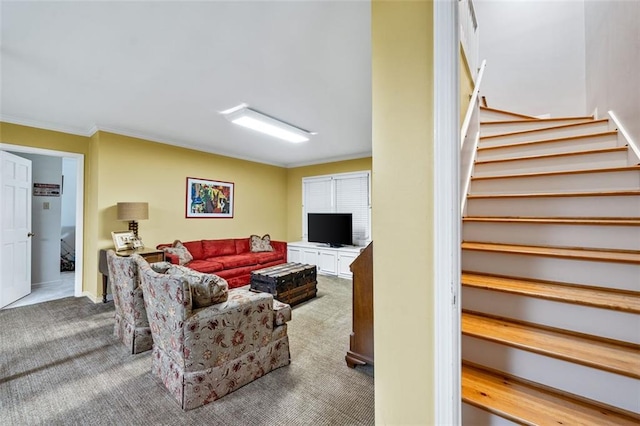 living room featuring crown molding and carpet flooring