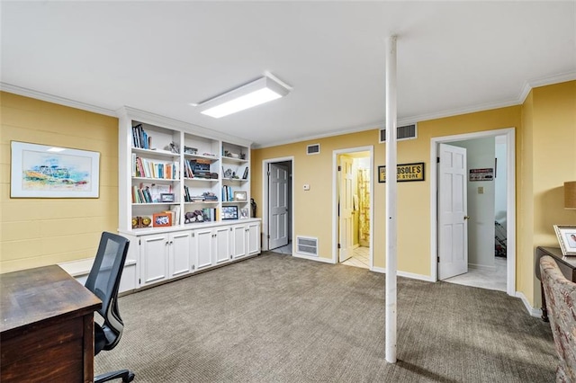 office area with ornamental molding, carpet, and built in shelves