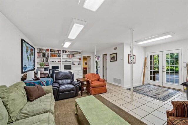 living room with french doors and light tile floors