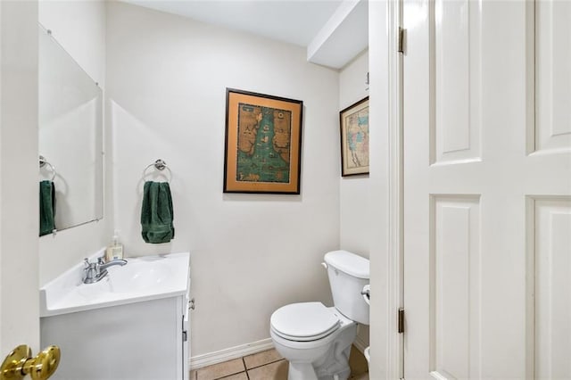 bathroom featuring tile flooring, toilet, and vanity