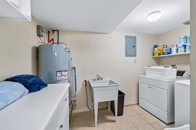 laundry area with washing machine and dryer and light tile flooring