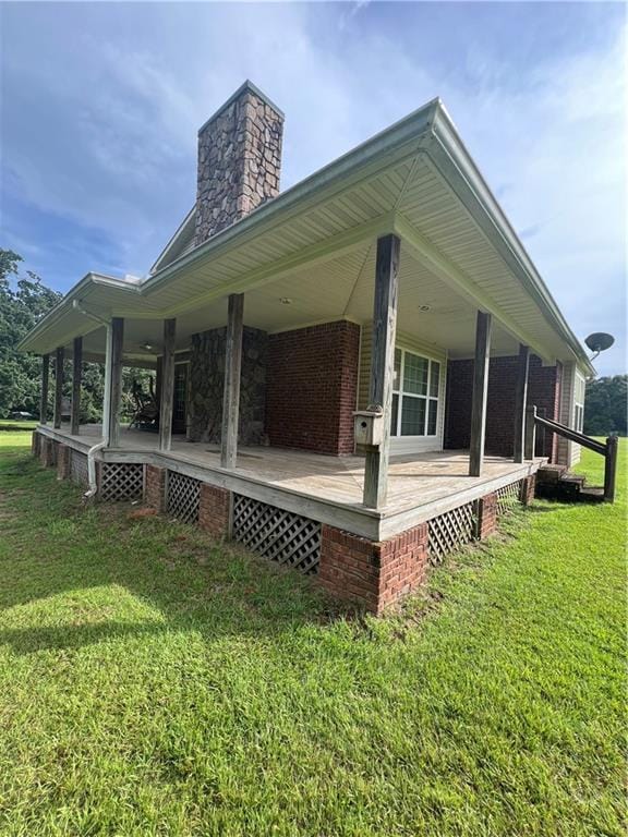 exterior space featuring a yard and covered porch