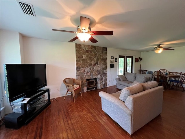 living room featuring dark hardwood / wood-style floors and ceiling fan