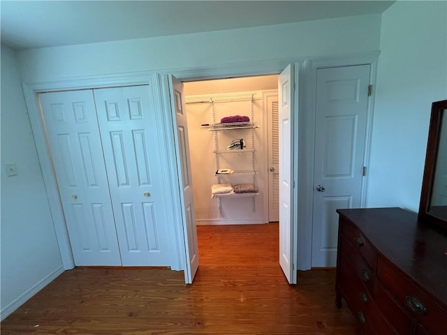 hallway featuring dark wood-type flooring