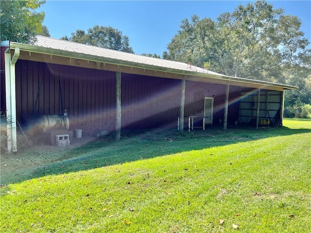 view of outdoor structure featuring a yard