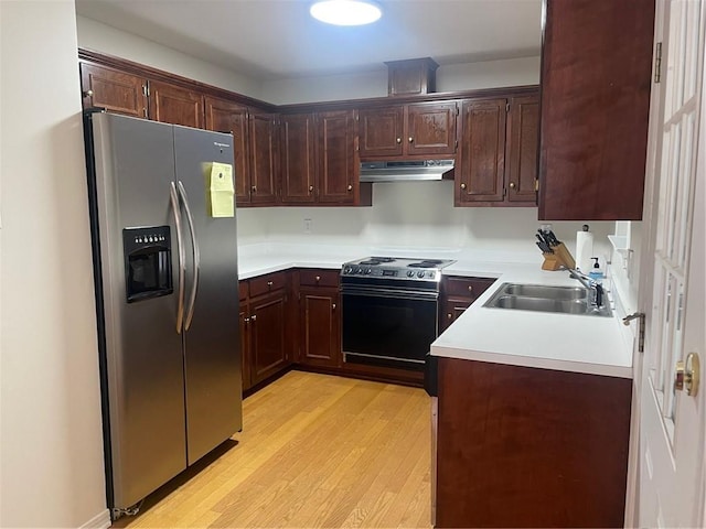 kitchen with light wood-type flooring, stainless steel fridge with ice dispenser, dark brown cabinets, sink, and electric range