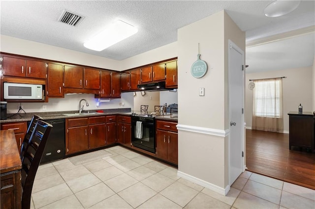 kitchen with a textured ceiling, sink, range hood, light hardwood / wood-style flooring, and black appliances