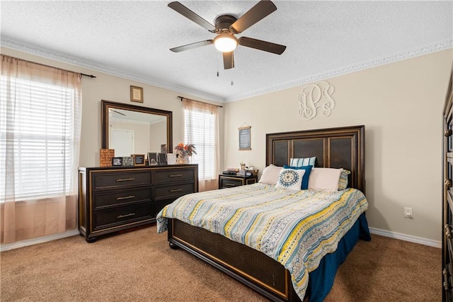 bedroom with ceiling fan, light colored carpet, crown molding, and a textured ceiling